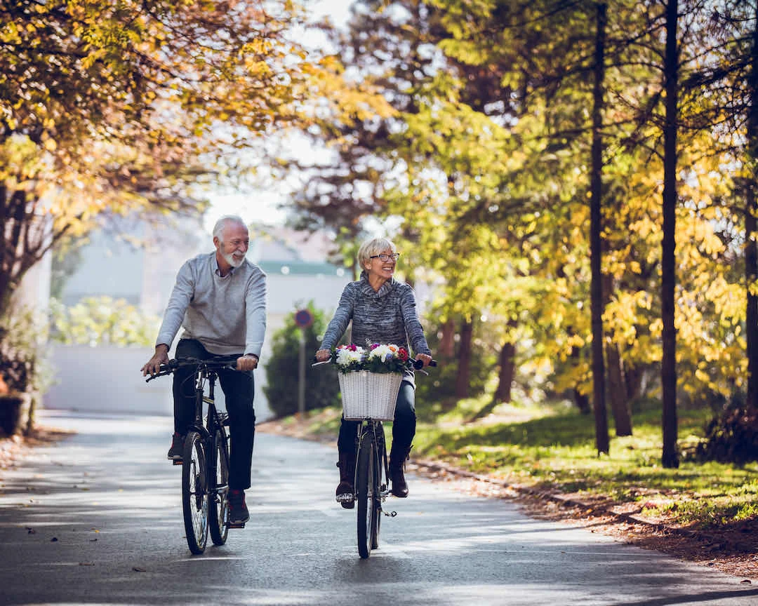 Older couple riding bikes