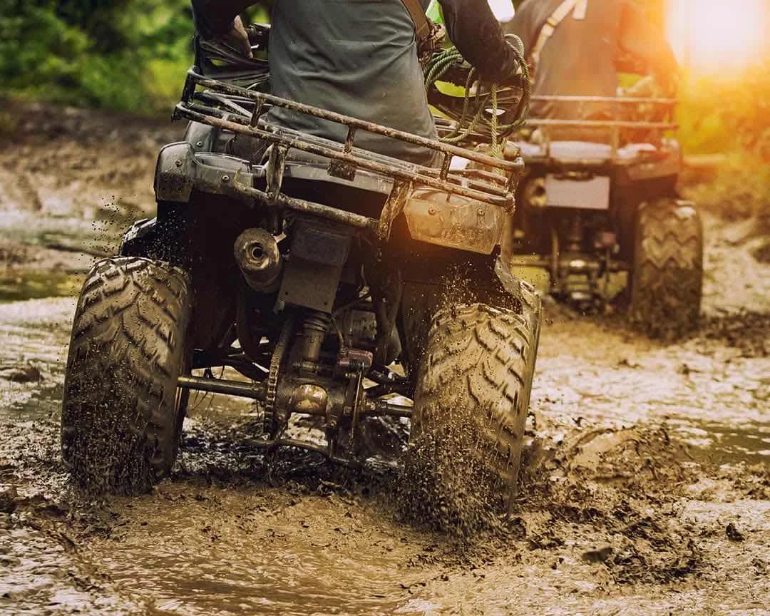 Riding ATV's in the mud